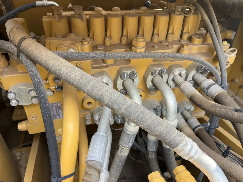 Used 2022 CAT 320GC excavator, main control valve block and hydraulic lines
