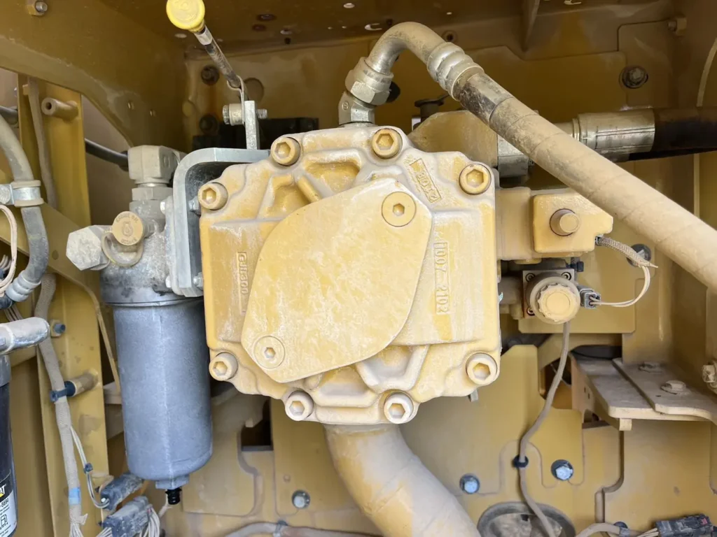 Used 2022 CAT 320GC excavator, hydraulic pump assembly and filter housing