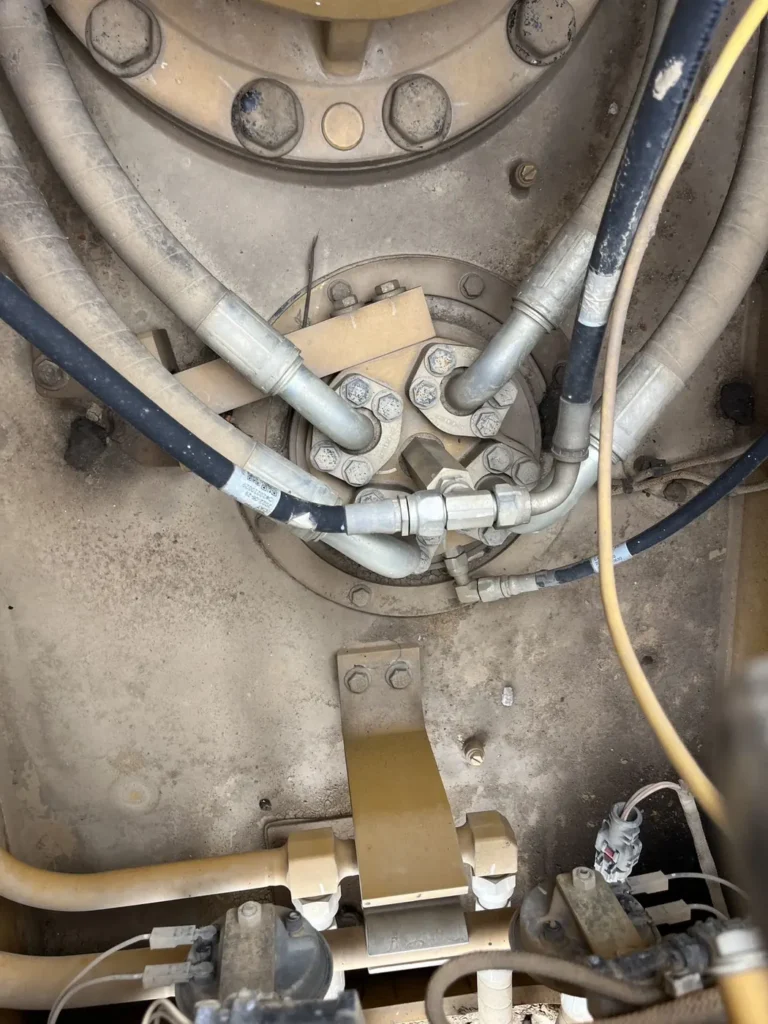 Used 2022 CAT 320GC excavator, centre joint and swivel from below