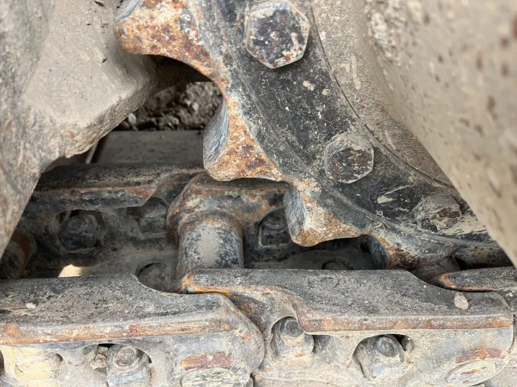 Used 2022 CAT 320GC excavator, track link, pin and bushing wear detail