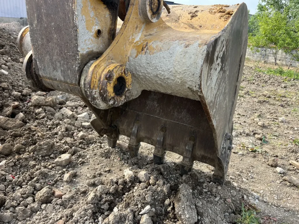 Used 2022 CAT 320GC excavator, bucket and teeth close-up